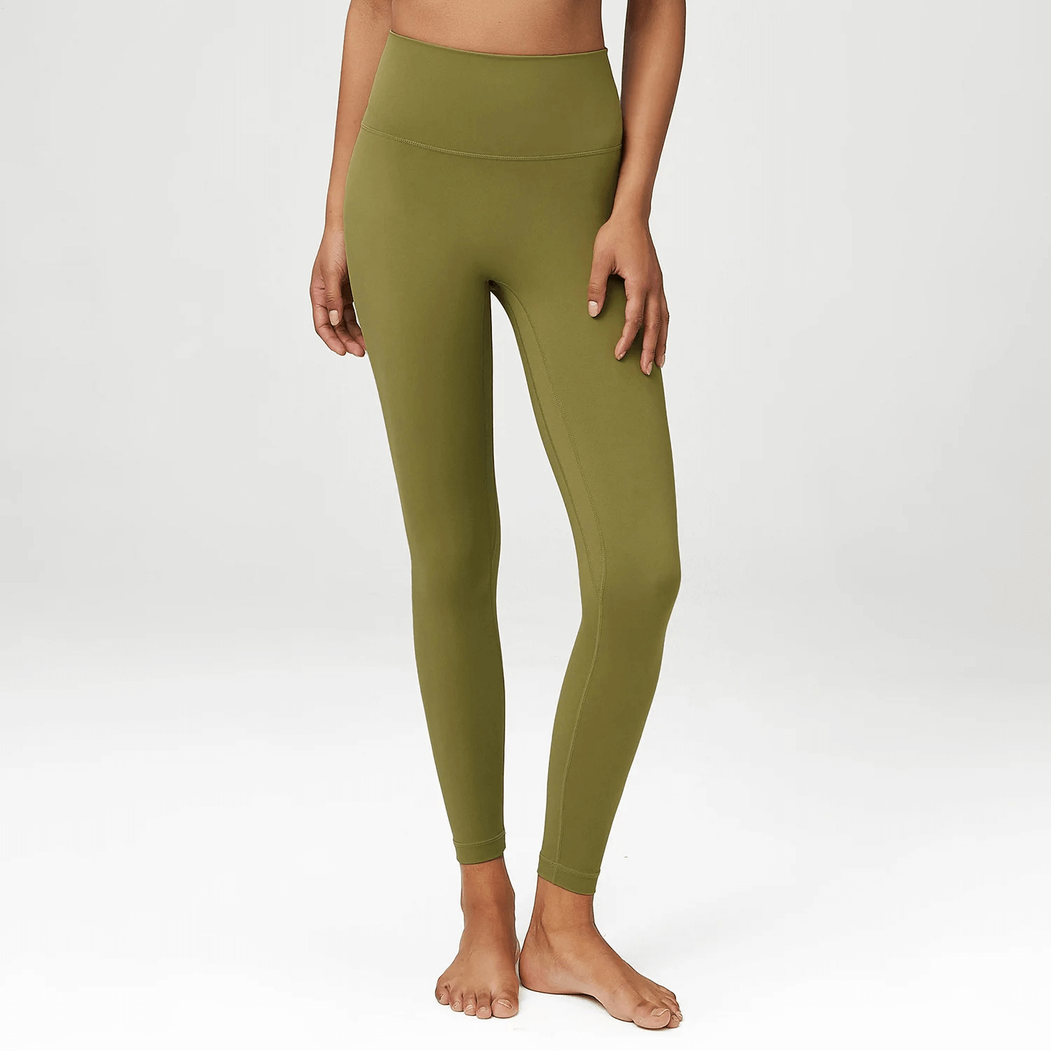 High-waist LYCRA yoga leggings in olive green on model, ideal for women seeking flexible, durable activewear for yoga and workouts.